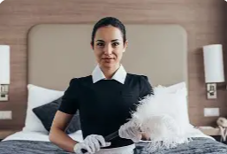 Housekeeping staff preparing a guest room